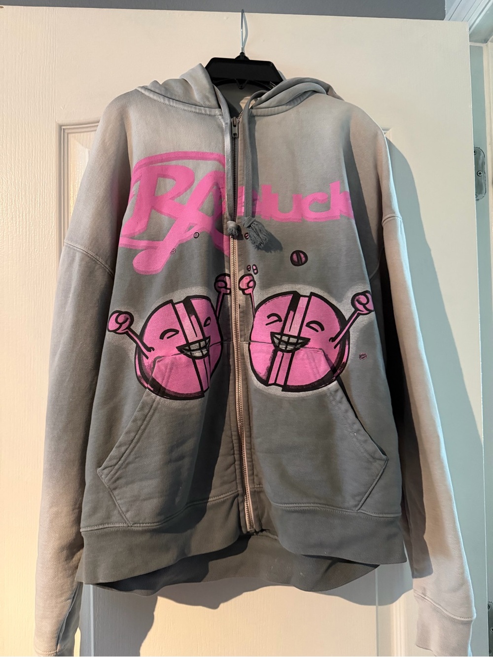 Men’s zip up jacket with graffiti writing